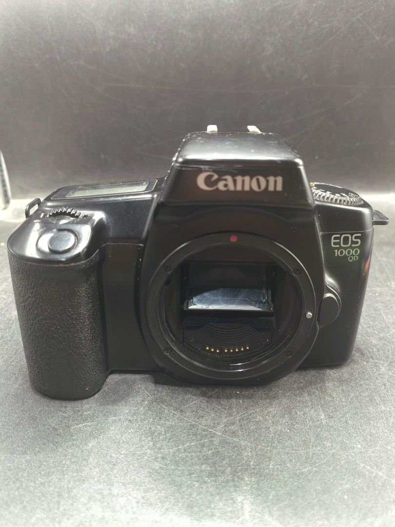 Canon EOS 1000 QD Film Camera (Category: Cameras) located in Cebu City. Submitted by dudes_villanueva (Listing ID 1430218655, Image 1). Description: Canon EOS 1000 QD (also known as the EOS Rebel II QD in North America) - 1990s. Note: Tested Functional. All sales final and non-refundable. Battery not included for testing and demo only. Condition: Working Mirror Flip, Curtain, and Dial Settings. Clean battery compartment. Has minimal scratches. So