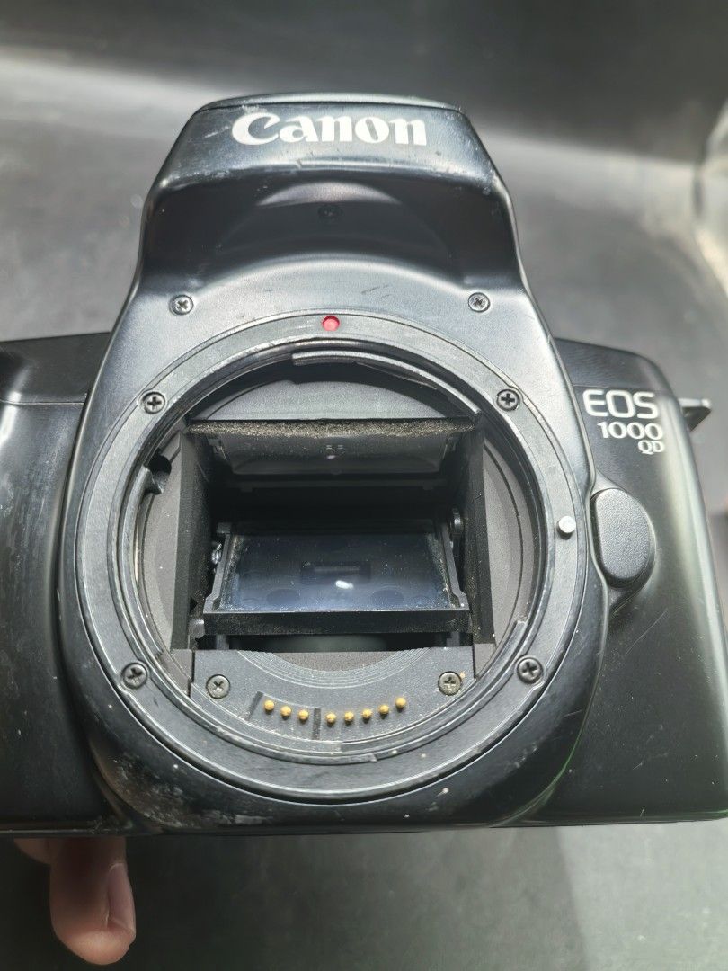Canon EOS 1000 QD Film Camera (Category: Cameras) located in Cebu City. Submitted by dudes_villanueva (Listing ID 1430218655, Image 2). Description: Canon EOS 1000 QD (also known as the EOS Rebel II QD in North America) - 1990s. Note: Tested Functional. All sales final and non-refundable. Battery not included for testing and demo only. Condition: Working Mirror Flip, Curtain, and Dial Settings. Clean battery compartment. Has minimal scratches. So