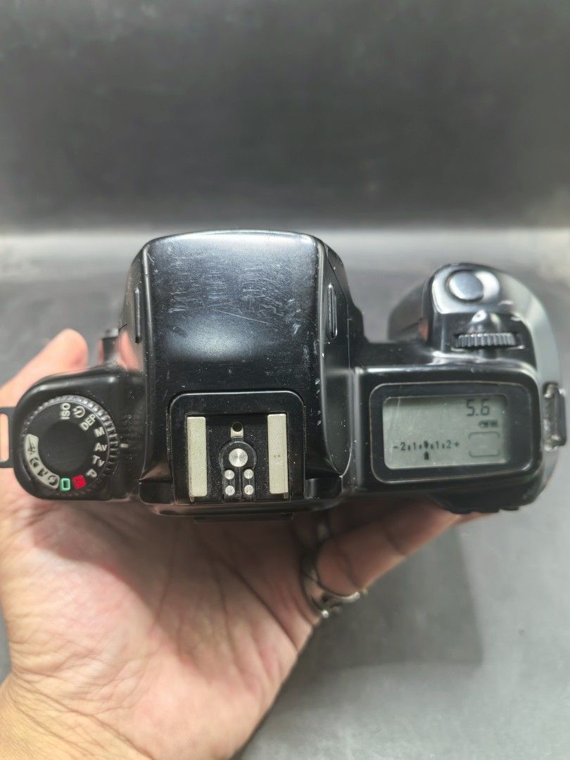 Canon EOS 1000 QD Film Camera (Category: Cameras) located in Cebu City. Submitted by dudes_villanueva (Listing ID 1430218655, Image 3). Description: Canon EOS 1000 QD (also known as the EOS Rebel II QD in North America) - 1990s. Note: Tested Functional. All sales final and non-refundable. Battery not included for testing and demo only. Condition: Working Mirror Flip, Curtain, and Dial Settings. Clean battery compartment. Has minimal scratches. So