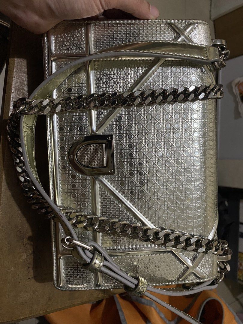 CD Metallic Silver Diorama Shoulder Bag (Category: Luxury Bags & Wallets) located in Munoz. Submitted by harm0nica337 (Listing ID 1430280759, Image 1). Description: Thrifted item, unknown authenticity, refer to the pics Flaws: Signs of use as shown in the last 3 pics MOP: Gcash (Price +SF) J&T express.