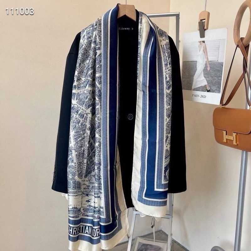 Christian Dior Map Print Scarf (Category: Scarves) located in Zamboanga. Submitted by smartstyle (Listing ID 1430292852, Image 1). Description: Elegant scarf featuring a map print design. The scarf has a navy blue and white color scheme. The brand name "Christian Dior" is visible at the bottom. The scarf is draped over a black blazer..