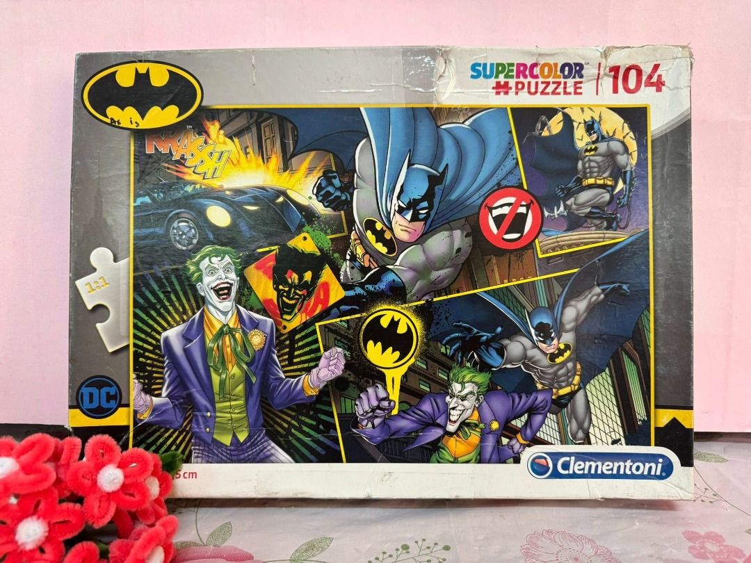 Clementoni Batman Supercolor Puzzle 104 Pieces (Category: Board Games & Puzzles) located in Caloocan City. Submitted by brightgamesph (Listing ID 1430254549, Image 1). Description: Clementoni puzzle features Batman and the Joker. It has 104 pieces and is part of the Supercolor Puzzle series. The box shows the Batman logo and the DC Comics logo. The puzzle is suitable for fans of Batman and puzzle enthusiasts. This is declared "AS IS" and "WYSIWYG