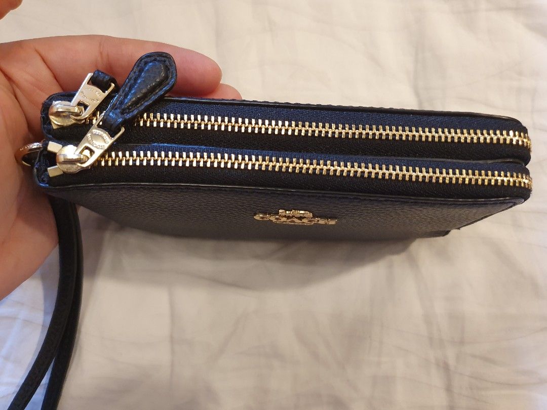 Coach Double Corner Zip Wristlet (Category: Luxury Bags & Wallets) located in Makati City. Submitted by an518x (Listing ID 1430322462, Image 2). Description: Price is firm. Black with Gold Hardware Authentic from Canada. Pick-up at Guadalupe, Makati or Meet-up at Guadalupe, SM Aura, Market Market only please.