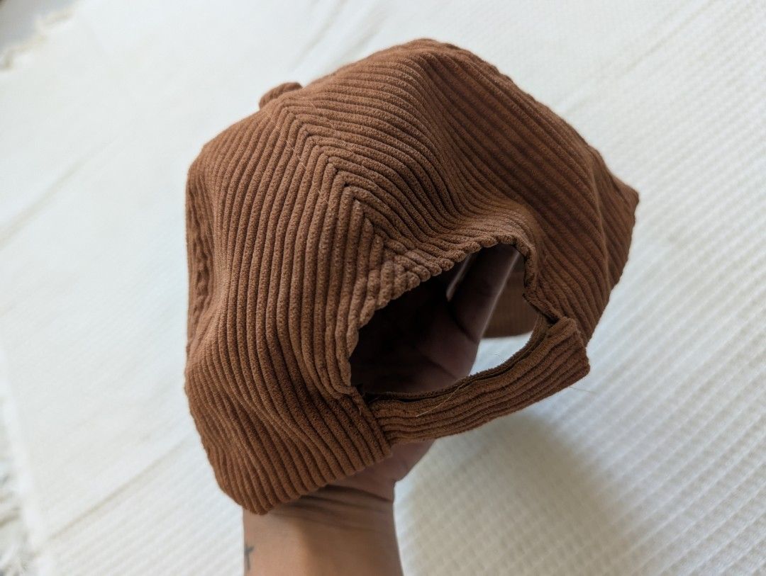 Corduroy Brown Cap (Category: Caps & Hats) located in Binan City. Submitted by fabpanda (Listing ID 1430294993, Image 3). Description: Brown corduroy cap. Features a curved brim and adjustable strap at the back. The interior has a mesh lining for breathability. Great for your 'estetik' instagrammable fits!🐼 God bless! ☺️🙏.