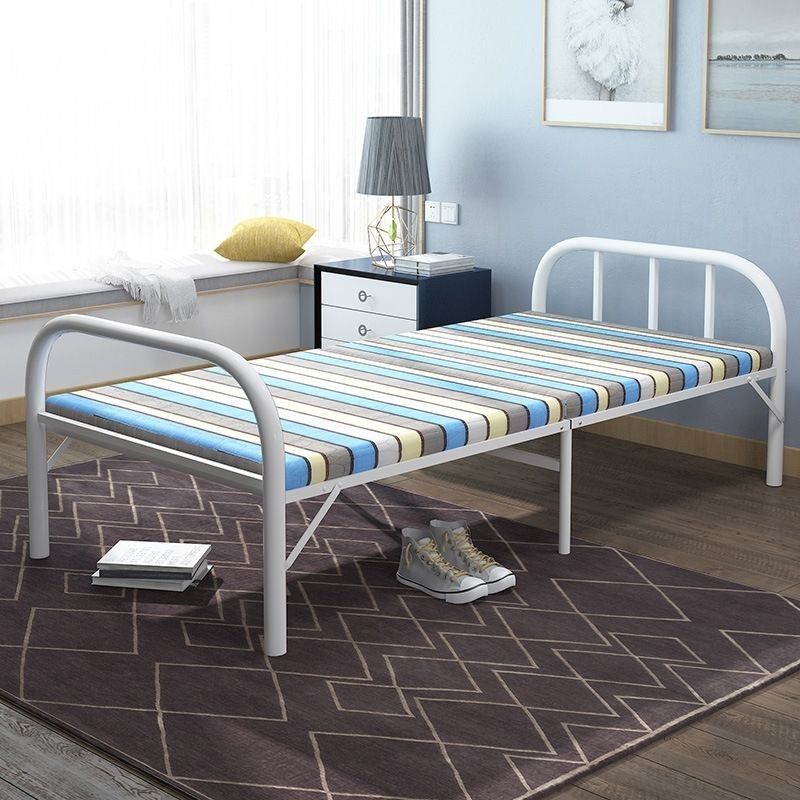 Folding Bed - Painted Steel Frame (Category: Bed Frames & Mattresses) located in San Jose del Monte. Submitted by yankeee88 (Listing ID 1430258855, Image 3). Description: - Foldable single bed - Striped mattress (blue, gray, white) - White metal frame - Sturdy design - Ideal for guests or small spaces - Easy to set up and fold away.