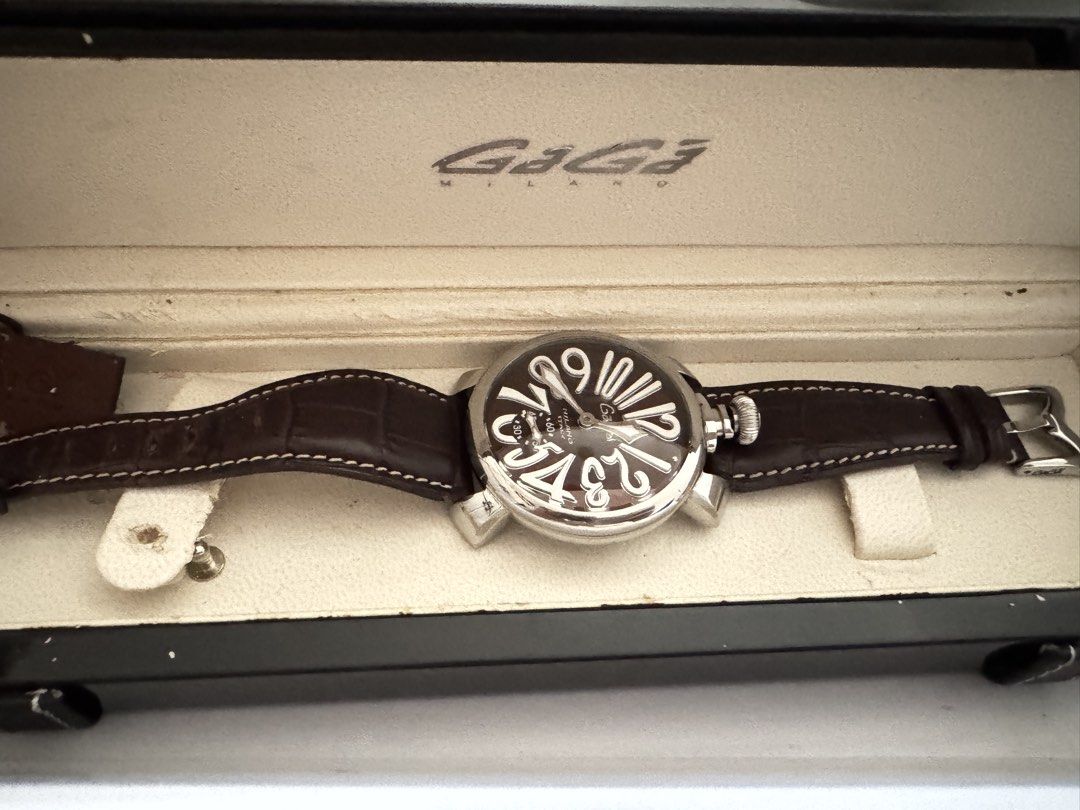 GaGa Milano Manuale 48mm Watch (Category: Luxury Watches) located in Caloocan City. Submitted by r_h_e_a10 (Listing ID 1430273672, Image 1). Description: Authentic GaGa Milano Manuale 48mm watch. Features a brown dial with large white numerals and a brown leather strap. The watch has a visible mechanical movement on the back. Comes with the original box and papers. Made in Italy..