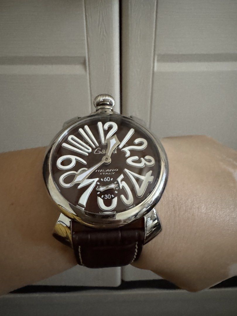 GaGa Milano Manuale 48mm Watch (Category: Luxury Watches) located in Caloocan City. Submitted by r_h_e_a10 (Listing ID 1430273672, Image 3). Description: Authentic GaGa Milano Manuale 48mm watch. Features a brown dial with large white numerals and a brown leather strap. The watch has a visible mechanical movement on the back. Comes with the original box and papers. Made in Italy..