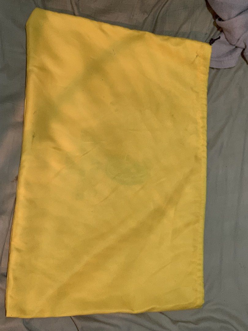 Goyard Dust Bag (Category: Luxury Bags & Wallets) located in Manila. Submitted by moneymann888 (Listing ID 1430367384, Image 3). Description: Sf Buyer shoulder Goyard dust bag. Features the Goyard logo and address on the front. The bag is yellow and has a drawstring closure. The bag is designed to protect luxury items. size Witdth 18inches and height 13 inches .