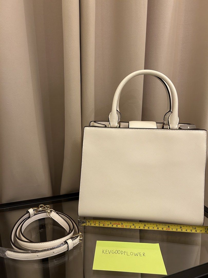 Kate Spade Reegan Top handle bag (Category: Luxury Bags & Wallets) located in Pasay City. Submitted by kevgoodflower (Listing ID 1430305329, Image 2). Description: Kate spade Reegan top handle Bought from Kate Spade CA outlet With detachable Crossbody strap Gold Hardware Off white saffiano leather Nylon interior lining Tags intact.