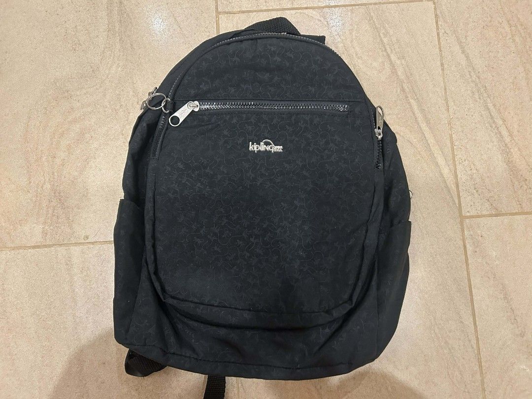 Kipling Black Backpack (Category: Backpacks) located in Mandaue City. Submitted by robertnpompompurin (Listing ID 1430316678, Image 1). Description: Orginal Kipling Bag Bought from Taiwan back in 2018 Negotiable Issues: Stain from coffee spill back in 2019 when in the UK. Wasn't able to remove stain. .