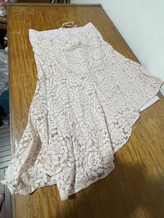 Light Pink Lace Midi Skirt (Category: Skirts) located in Quezon City. Submitted by mimi_declutters (Listing ID 1430254210, Image 1). Description: - Light pink lace skirt - Size: XS, fits size 28 waistline - Condition: Good - Delicate lace design - Perfect for casual or dressy wear - used only once for a wedding - personal preloved NOT UKAY - can request more photos via dm - lalamove or j&t - slightly negotiable.