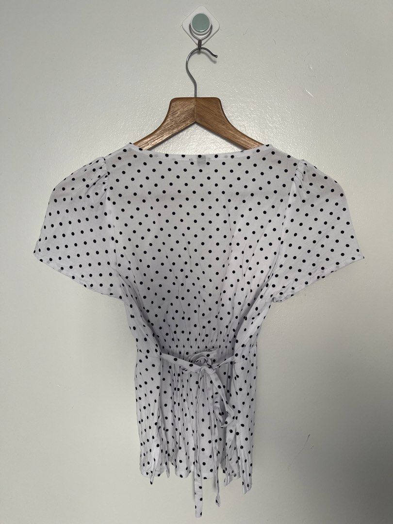 Linen Polka Dot Wrap Top (Category: Blouses) located in Cavite. Submitted by seona.mnl (Listing ID 1430347488, Image 2). Description: - used once in a trip - size small to med - super flattering, linen - garterized at the back.