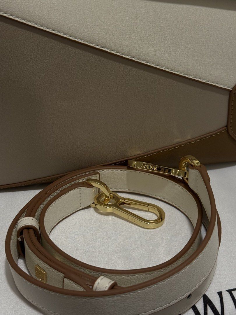 Loewe Puzzle Taupe in Small (Category: Luxury Bags & Wallets) located in Manila. Submitted by cldluxefinds (Listing ID 1426153170, Image 3). Description: - Authentic and no issue - 100% brand new - Bought in Hong Kong - Inclusion: Box, dust bag, 2 straps - Size: 24 cm, 2 available colors (check my other listing); Both are neutral colors - white / cream /beige.