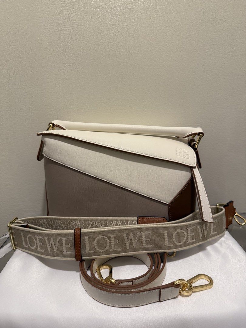 Loewe Puzzle Taupe in Small (Category: Luxury Bags & Wallets) located in Manila. Submitted by cldluxefinds (Listing ID 1426153170, Image 1). Description: - Authentic and no issue - 100% brand new - Bought in Hong Kong - Inclusion: Box, dust bag, 2 straps - Size: 24 cm, 2 available colors (check my other listing); Both are neutral colors - white / cream /beige.