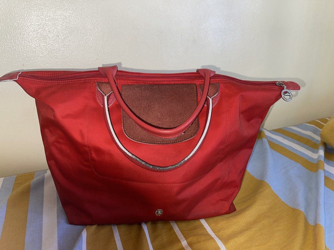 Longchamp Red Tote Bag (Category: Luxury Bags & Wallets) located in Manila. Submitted by randompreloved.stuff29 (Listing ID 1430284849, Image 2). Description: bought for 3950 last 2023 #tote #thrift #declutter #bag #lepliage.
