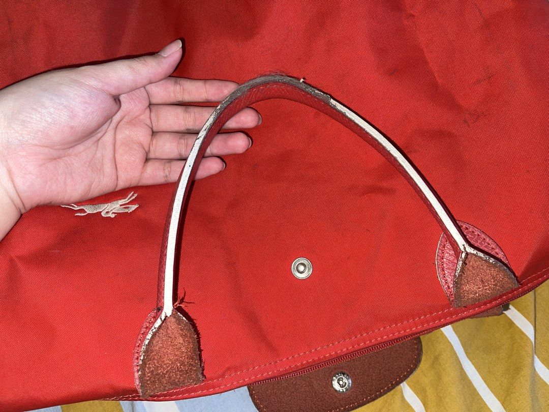 Longchamp Red Tote Bag (Category: Luxury Bags & Wallets) located in Manila. Submitted by randompreloved.stuff29 (Listing ID 1430284849, Image 3). Description: bought for 3950 last 2023 #tote #thrift #declutter #bag #lepliage.