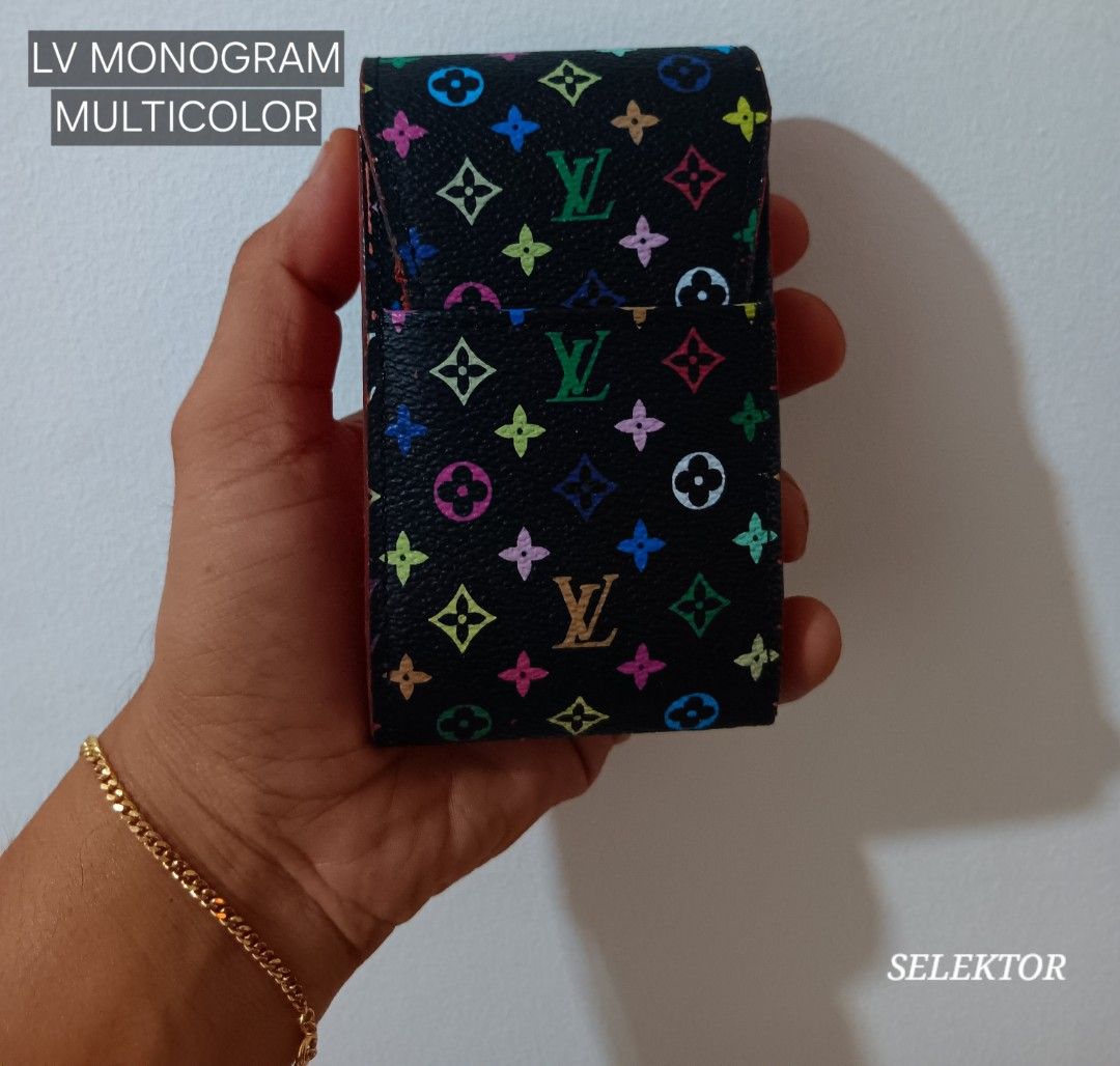 Louis Vuitton LV Monogram Multicolor Cigarette Case (Category: Luxury Bags & Wallets) located in Dauis. Submitted by udenglegaspi (Listing ID 1430251915, Image 1). Description: Authentic Louis Vuitton cigarette case in the LV Monogram Multicolor design. Features a black exterior with colorful LV logos and a red interior. The interior is stamped with the Louis Vuitton Paris logo and "Made in France"..
