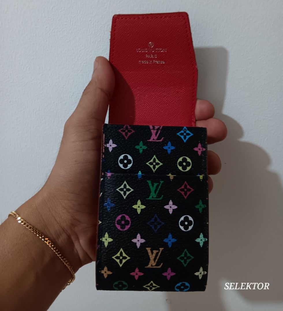 Louis Vuitton LV Monogram Multicolor Cigarette Case (Category: Luxury Bags & Wallets) located in Dauis. Submitted by udenglegaspi (Listing ID 1430251915, Image 3). Description: Authentic Louis Vuitton cigarette case in the LV Monogram Multicolor design. Features a black exterior with colorful LV logos and a red interior. The interior is stamped with the Louis Vuitton Paris logo and "Made in France"..