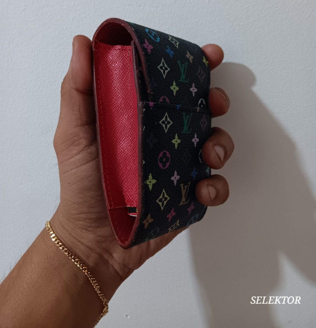 Louis Vuitton LV Monogram Multicolor Cigarette Case (Category: Luxury Bags & Wallets) located in Dauis. Submitted by udenglegaspi (Listing ID 1430251915, Image 2). Description: Authentic Louis Vuitton cigarette case in the LV Monogram Multicolor design. Features a black exterior with colorful LV logos and a red interior. The interior is stamped with the Louis Vuitton Paris logo and "Made in France"..