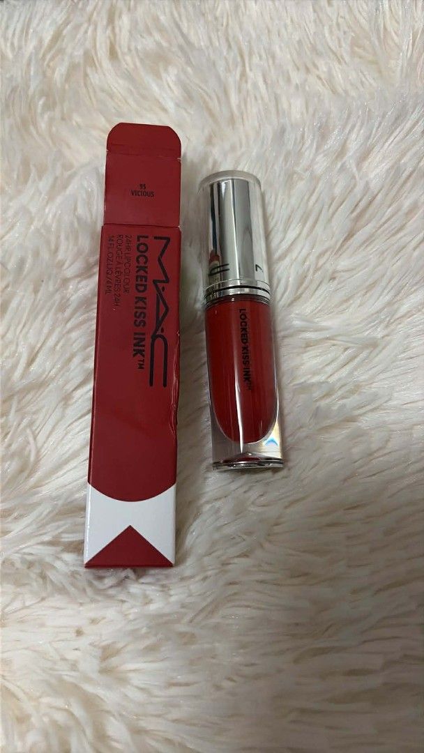 MAC Locked Kiss Ink Lipstick (Category: Makeup) located in Pugo. Submitted by abshopfinity (Listing ID 1430318207, Image 2). Description: MAC Locked Kiss Ink lipstick in various shades. The images show the lipstick with its original packaging. Available shades include: 88, 96, 11, and 86. Each lipstick is a liquid lipstick. The packaging includes the brand name and product name..