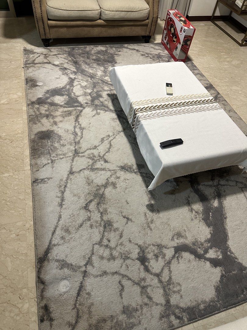 Marble Pattern Rug (Category: Carpets & Mats) located in Singapore. Submitted by seller09 (Listing ID 1430345719, Image 1). Description: Rug features a beautiful marble pattern. It has been used and shows some wear and tear, as seen in the images. It would be a great addition to any living room. Please review the photos carefully before purchasing. 200 x 300.