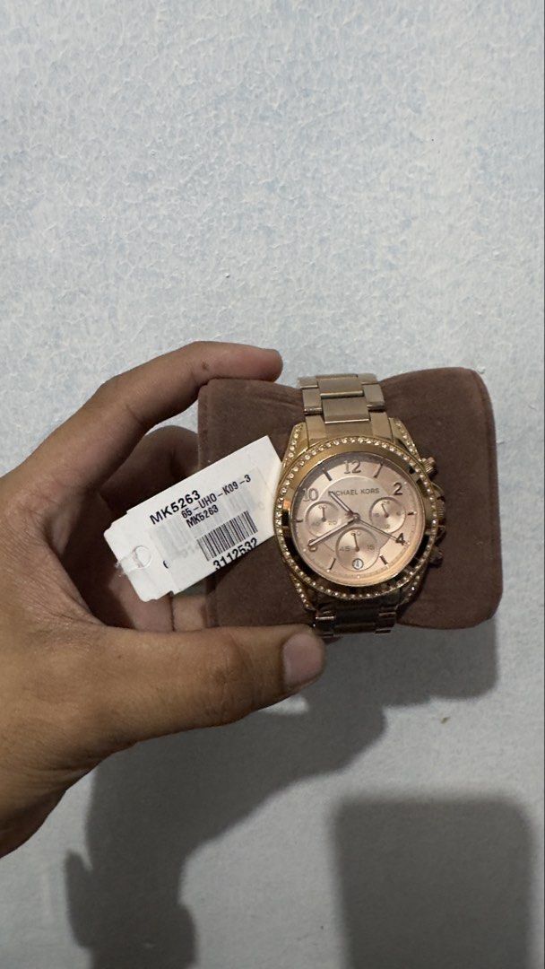 Michael Kors MK5263 Rose Gold Watch (Category: Women's Watches) located in Pateros City. Submitted by silasweir (Listing ID 1430273619, Image 2). Description: Elegant Michael Kors watch, model MK5263. Features a rose gold finish with a crystal-studded bezel. Includes a matching rose gold bracelet strap. The watch has a chronograph function and a date display. Comes with its original box..