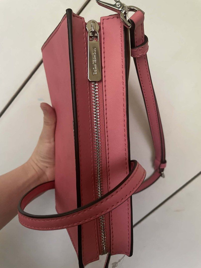 Michael Kors Pink Crossbody Bag Authentic (Category: Cross-body Bags) located in Cebu City. Submitted by greatstuffshopper (Listing ID 1430364268, Image 3). Description: Never used This was gifted from a relative coming from the US No flaws and still in pristine new condition.