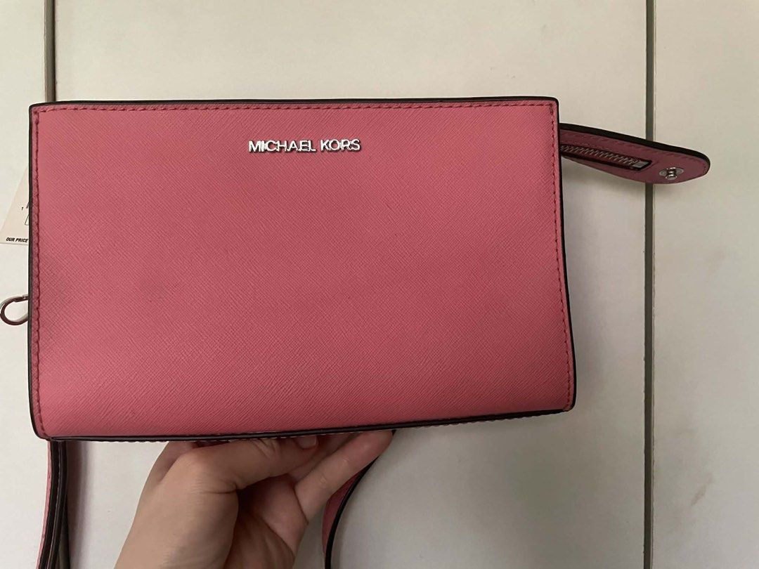 Michael Kors Pink Crossbody Bag Authentic (Category: Cross-body Bags) located in Cebu City. Submitted by greatstuffshopper (Listing ID 1430364268, Image 2). Description: Never used This was gifted from a relative coming from the US No flaws and still in pristine new condition.