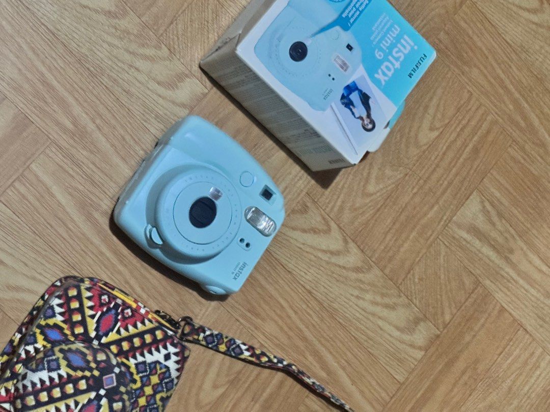 [MINT] Fujifilm Instax Mini 9 Instant Camera - Ice Blue (Full Set) (Category: Cameras) located in Quezon City. Submitted by young_god23 (Listing ID 1430292600, Image 2). Description: [Condition] 10/10 — All Goods. Like new and fully functional. No scratches on the lens or body. Flash, film counter, and shutter are all working perfectly. [Features] • Selfie Mirror: Built-in mirror next to the lens for perfectly framed selfies. • Close-up Lens Atta