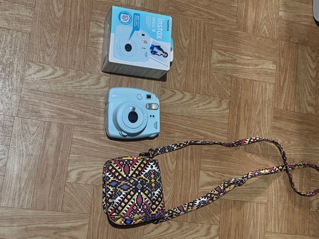 [MINT] Fujifilm Instax Mini 9 Instant Camera - Ice Blue (Full Set) (Category: Cameras) located in Quezon City. Submitted by young_god23 (Listing ID 1430292600, Image 3). Description: [Condition] 10/10 — All Goods. Like new and fully functional. No scratches on the lens or body. Flash, film counter, and shutter are all working perfectly. [Features] • Selfie Mirror: Built-in mirror next to the lens for perfectly framed selfies. • Close-up Lens Atta