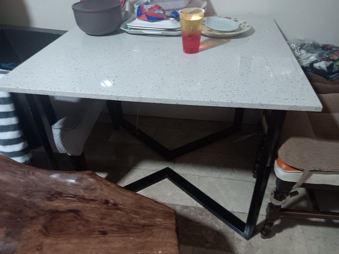 Modern Dining Table with Black Metal Legs (Category: Tables & Sets) located in Las Pinas. Submitted by jesus1smysavi0r (Listing ID 1430240153, Image 2). Description: Stylish dining table featuring a speckled white tabletop and sturdy black metal legs. The table has a rectangular shape, perfect for small spaces. The design is modern and versatile, fitting well in various interior styles..