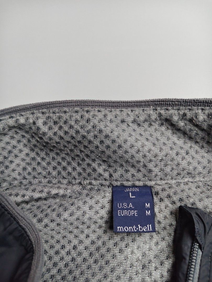 Montbell ClimaPlus Mesh Vest (Category: Vests) located in Tacloban City. Submitted by solothriftfinds (Listing ID 1430338682, Image 3). Description: Montbell vest with a full zip closure. Features a black outer layer and a gray mesh lining. The vest has a stand-up collar. The inner lining is made of ClimaPlus Mesh material. The size is M for USA and Europe, and L for Japan. The vest has the Montbell logo on the chest..