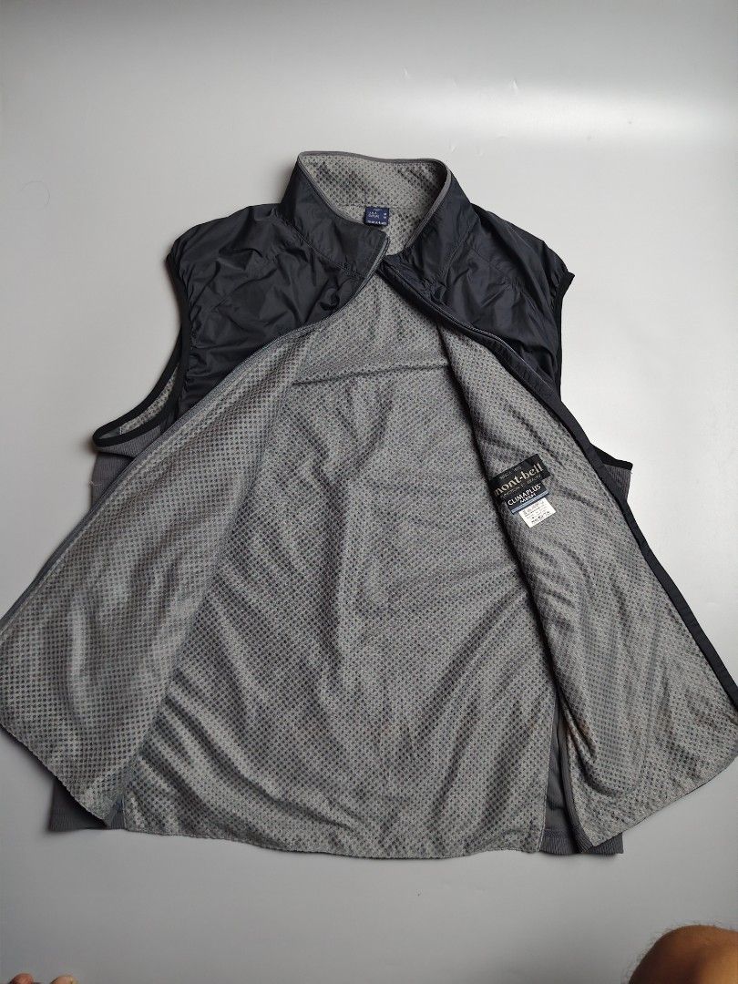 Montbell ClimaPlus Mesh Vest (Category: Vests) located in Tacloban City. Submitted by solothriftfinds (Listing ID 1430338682, Image 2). Description: Montbell vest with a full zip closure. Features a black outer layer and a gray mesh lining. The vest has a stand-up collar. The inner lining is made of ClimaPlus Mesh material. The size is M for USA and Europe, and L for Japan. The vest has the Montbell logo on the chest..