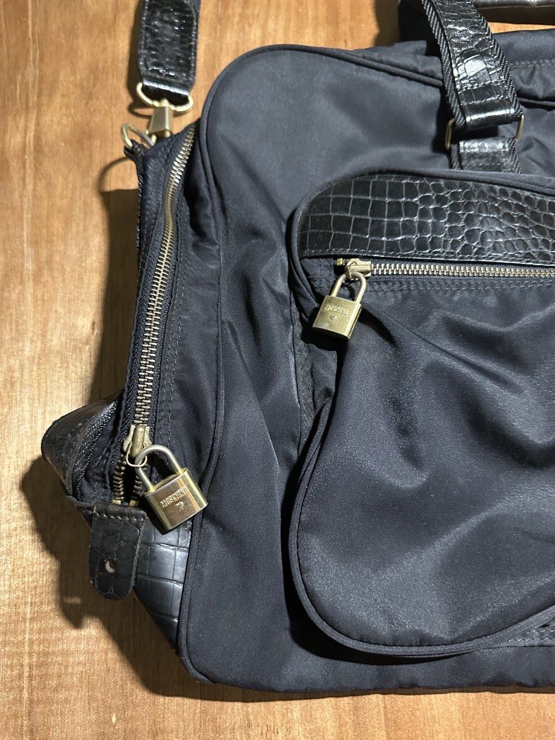 Moschino Travel Bag (Category: Luxury Bags & Wallets) located in Bacolod City. Submitted by dannnsoy (Listing ID 1430335480, Image 3). Description: Moschino Travel Bag •In very good condition •Issue: Missing keys and signs of usage •Price: 1999 only 📍Note: Color may vary to due lighting and camera resolution. .