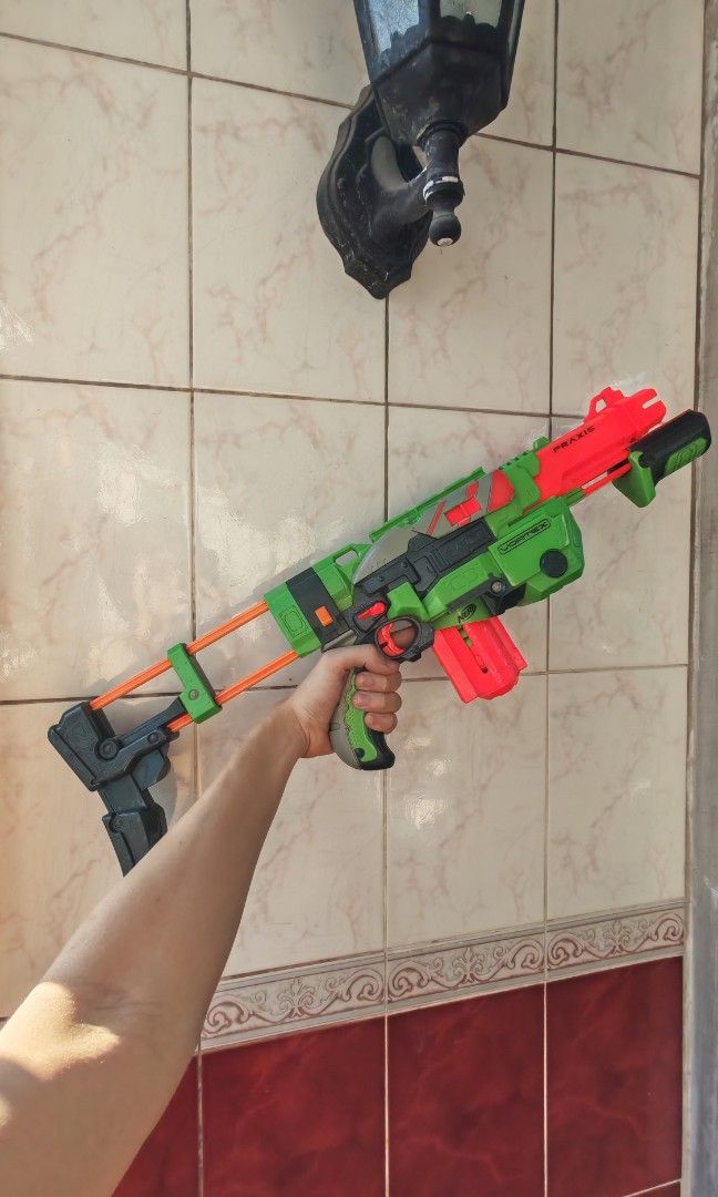 Nerf Gun Rifle (Category: Action & Battle Toys) located in Manila. Submitted by hustlefinds31 (Listing ID 1430298292, Image 1). Description: selling, Nerf Gun Cortex Praxis - Rifle/Shotgun complete with disc bullets and pump action all working with detachable shoulder support..