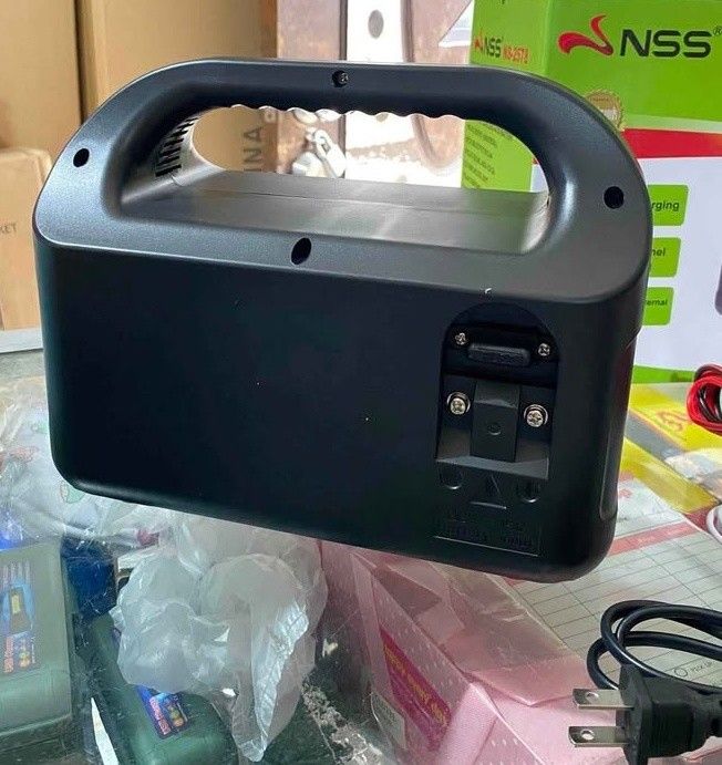 NSS NS-2578 Portable Power Station (Category: Electrical, Adaptors & Sockets) located in Manila. Submitted by emil_online_shop (Listing ID 1430345396, Image 3). Description: NSS NS-2578 portable power station features a built-in 150W inverter. It has AC and DC outputs, including USB ports. The device is compatible with various electronics like cameras, phones, and laptops. It comes with a solar panel, charging cables, and crocodile clips. It also