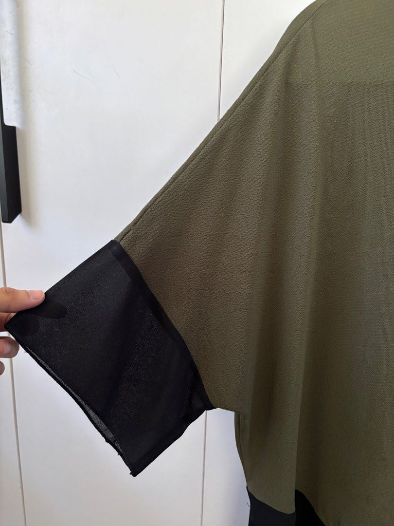 Olive Green and Black Color Block Top (Category: Sleeveless) located in Bacoor. Submitted by alyxcoll (Listing ID 1430299873, Image 3). Description: ✨ fits M-L ✨ lightweight, breathable to wear ✨ black part is made from sheer material; see through ✨ a part of the slit got ripped off but not noticeable from a far (check pic) price is negotiable delivery: lbc, j&t, ggx only.