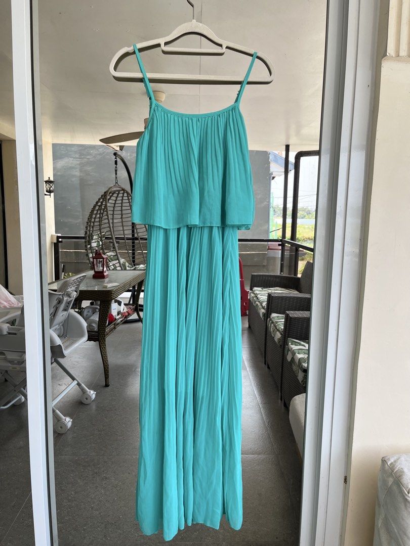Teal/Turquoise Pleated Maxi Dress (Category: Dresses) located in Bulacan. Submitted by rks_closet (Listing ID 1430243911, Image 1). Description: Elegant maxi dress in a beautiful teal color. Features a pleated bodice and flowing skirt. Perfect for special occasions or a night out. The dress has thin straps and a flattering silhouette. It is a versatile piece that can be dressed up or down..