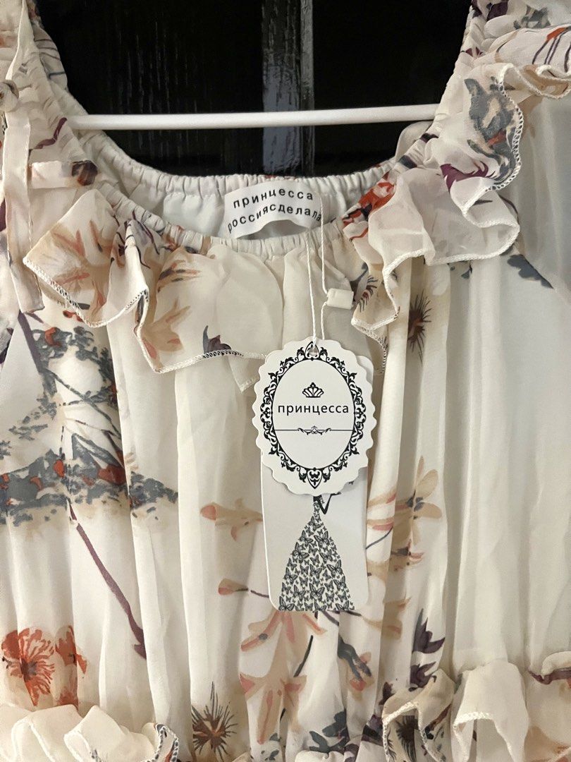 Summer Floral Flowy Maxi Dress (Category: Dresses) located in Quezon City. Submitted by leisprelovedph (Listing ID 1430234742, Image 3). Description: Floral Maxi Dress 🌸 • Light, flowy chiffon fabric with soft floral print • Off-shoulder style with ruffle details + elastic waist • Very flattering and airy—perfect for dates, brunch, beach or garden events •Bought from Dubai Global City pop up store for 250 AED, Russian Brand: принцесса (Princess)
