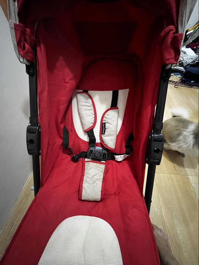 Red Baby Stroller (Category: Strollers) located in San Mateo. Submitted by littlenyora (Listing ID 1430393162, Image 2). Description: Red baby stroller features a canopy and a safety harness. It has a red seat with a white cushion. The stroller has black handles and a black frame. The stroller has four wheels. and all in good condition rarely use brand giant carrier.