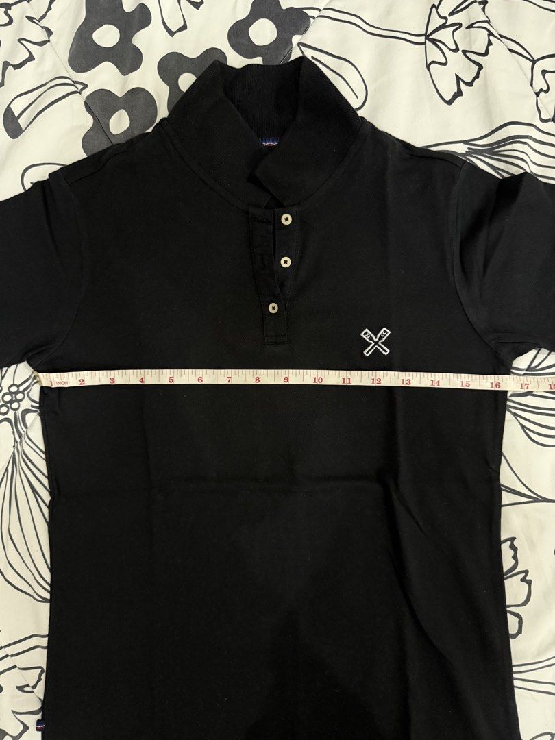 Regatta Essentials Polo Shirt - Black & White Set (Category: Shirts) located in Quezon City. Submitted by hg.declutters (Listing ID 1430305234, Image 3). Description: Regatta Essentials polo shirts in black and white. Both shirts feature a small logo on the chest and a button-up collar. The black shirt has a small size tag, and the white shirt has some discoloration under the arm. Both shirts are size small. Take both for 600.