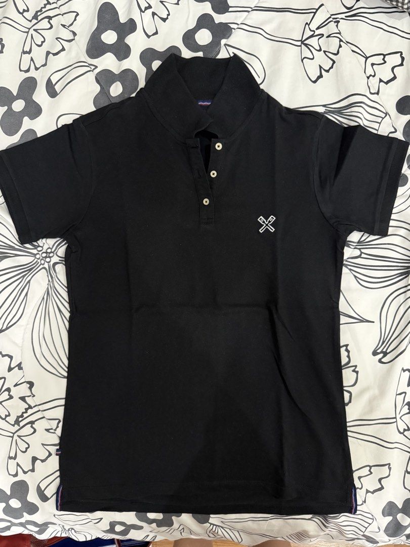 Regatta Essentials Polo Shirt - Black & White Set (Category: Shirts) located in Quezon City. Submitted by hg.declutters (Listing ID 1430305234, Image 1). Description: Regatta Essentials polo shirts in black and white. Both shirts feature a small logo on the chest and a button-up collar. The black shirt has a small size tag, and the white shirt has some discoloration under the arm. Both shirts are size small. Take both for 600.