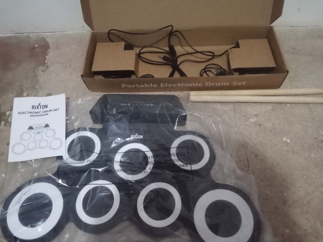 Rixton Portable Electronic Drums Set (DDP006 SPK-BLACK) (Category: Musical Instruments) located in Morong. Submitted by gakushuu (Listing ID 1430321024, Image 1). Description: Inclusion: -Drum Pad with Built in Speakers -Pedals -Drumsticks -Aux Cable -Type C Cable MOP: GCASH MOD: J&T LALAMOVE Like New, Used for like 2 times only (Need po fund kaya byebye hobby).