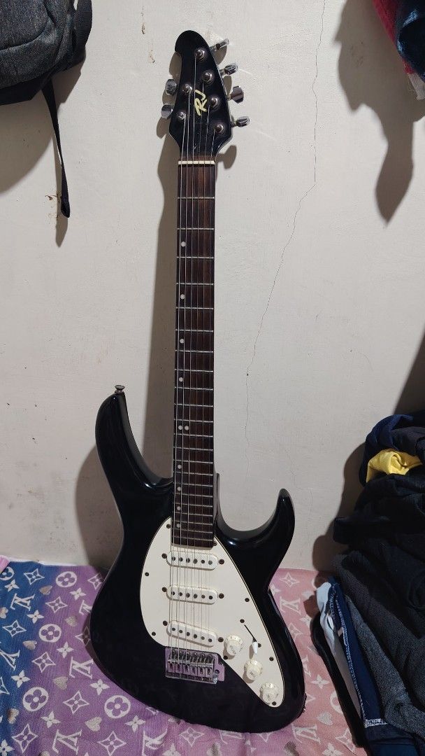 Rj Electric Guitar (Category: Musical Instruments) located in Manila. Submitted by choisseung_hyo (Listing ID 1430251604, Image 1). Description: Rj guitar silang cavite Issues-rusty parts, scratches and minor dents Just done a besic set up, new strings Electronics are working well Lalamove.