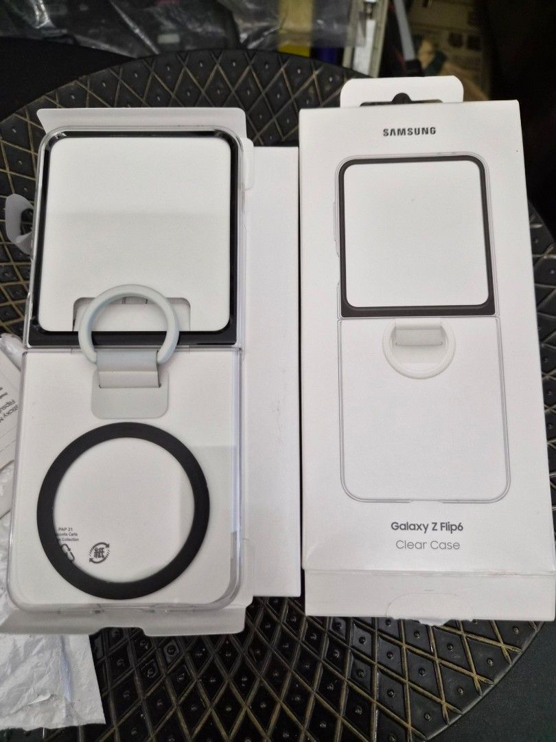 Samsung Galaxy Z Flip 6 Clear Case (Category: Cases & Sleeves) located in Makati City. Submitted by kurekajan (Listing ID 1430287533, Image 1). Description: Genuine Samsung Galaxy Z Flip clear case. Includes a ring grip and a MagSafe-compatible design. The case is designed to protect the phone while maintaining its sleek look. The packaging includes the case and the original box. It is a clear case, allowing the phone's color to show through..