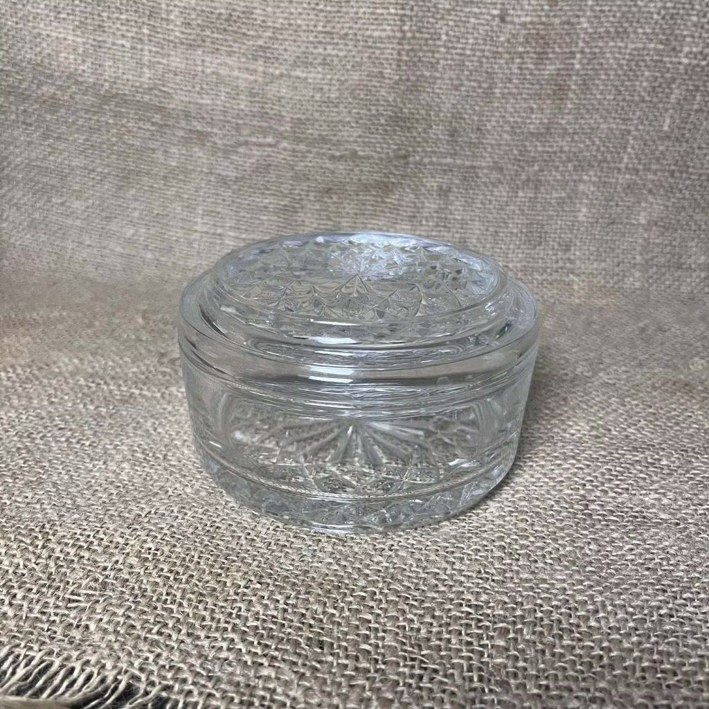 Showa Retro Glass Container with Lid (Category: Food Organization & Storage) located in Bulacan. Submitted by ceramicscubby (Listing ID 1430359657, Image 1). Description: Size: 4.25 D x 2.3 H in. ❗️CLOSING DOWN SALE, ALL PRICES ARE MARKED DOWN. WE WILL NOT BE ACCEPTING OFFERS LOWER THAN OUR ASKING PRICE. ❗️ Clear glass jar with a lid. The jar has a round shape with a decorative pattern on the lid and base. The jar is suitable for storing small it