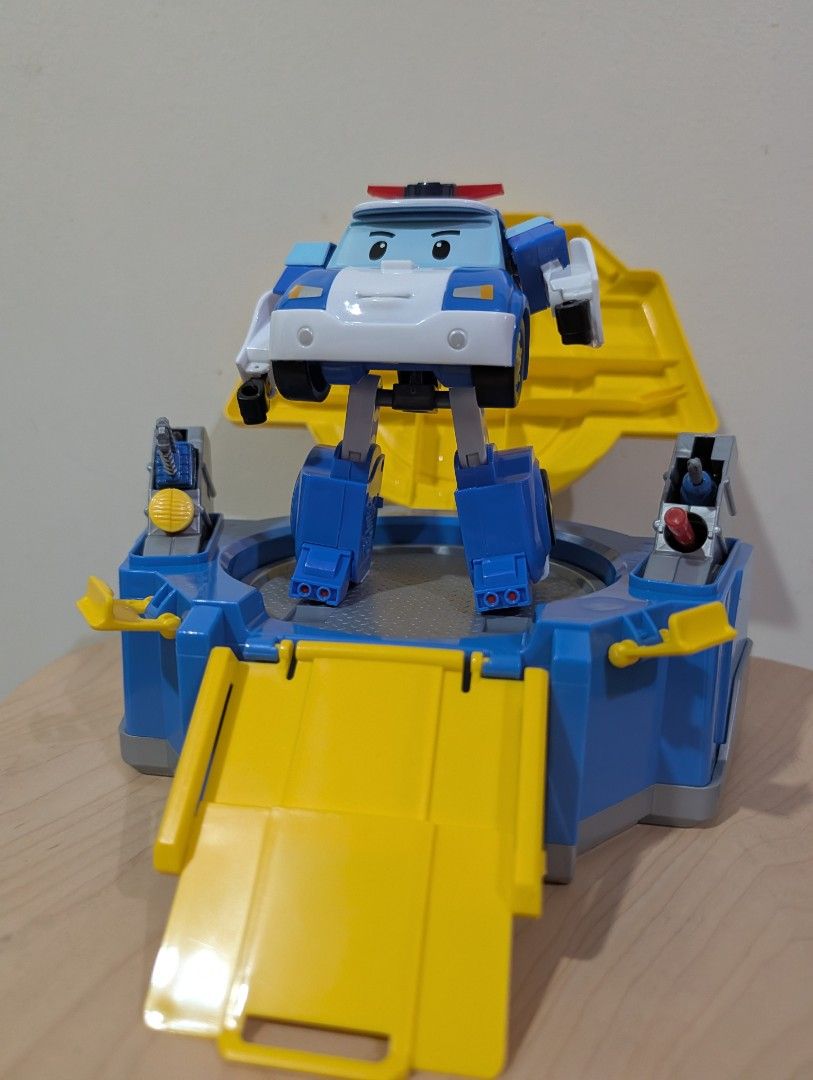 Silverlit Robocar Carry Case and transforming Poli (Category: Kids Toys) located in Manila. Submitted by cart_rd (Listing ID 1430318787, Image 3). Description: Robocar Poli toy features a transforming Poli character and a play set. The set includes a platform, a ramp, and other interactive elements. The toy is designed with bright colors and detailed features, perfect for imaginative play. The set folds up for easy storage and transport. - good a