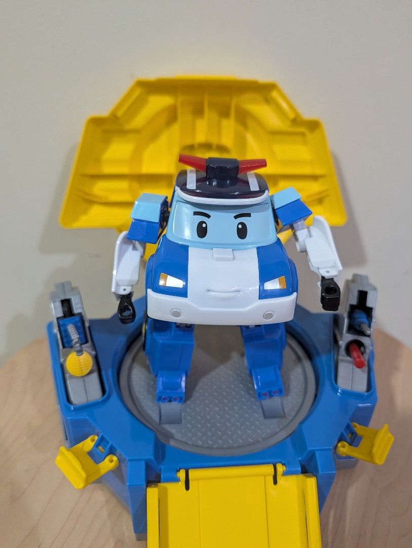 Silverlit Robocar Carry Case and transforming Poli (Category: Kids Toys) located in Manila. Submitted by cart_rd (Listing ID 1430318787, Image 1). Description: Robocar Poli toy features a transforming Poli character and a play set. The set includes a platform, a ramp, and other interactive elements. The toy is designed with bright colors and detailed features, perfect for imaginative play. The set folds up for easy storage and transport. - good a