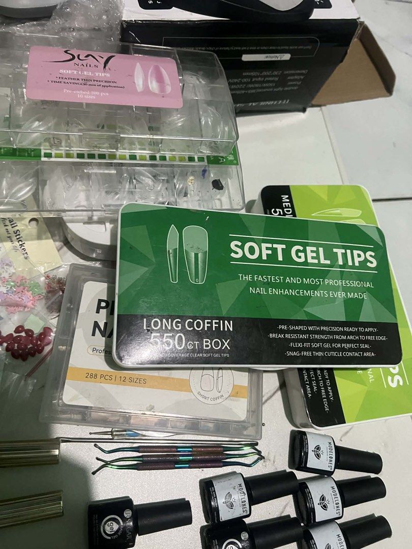 SOFTGEL NAIL EXTENSION - TAKE ALL ONLY COMPLETE SET (Category: Hands & Nails) located in Manila. Submitted by mikay3laph (Listing ID 1430359429, Image 3). Description: For take all only. Lowest price is 4k pass na po sa tawad. Inclusions - Sterilizer for cleaning materials - Nail Drill - Gel Polish - Nail Polish - Charms - UV Lamp - UV Flash Cure - Materials for cutting, design etc. LOWEST PRICE FOR COMPLETE SET.