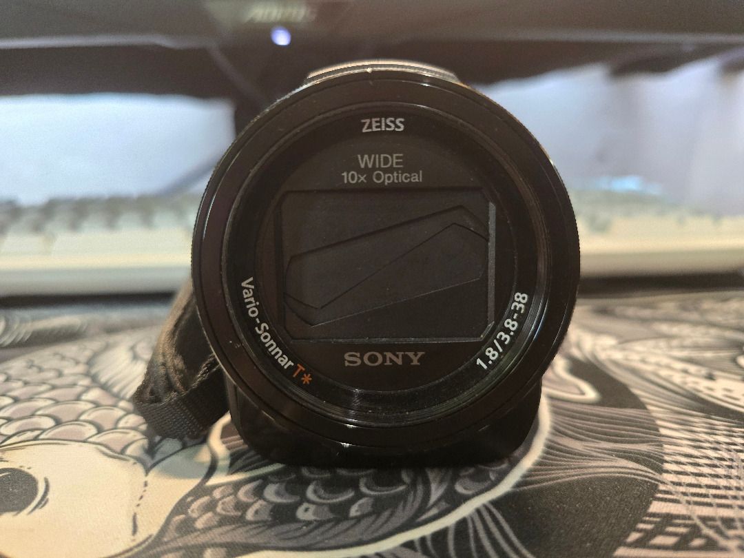Sony Handycam AX33 (Category: Cameras) located in Manila. Submitted by jadecutter (Listing ID 1430259328, Image 3). Description: Sony FDR-AX33 4K Handycam Reason for selling: Seldom used, no longer needed. Bought from Spain years ago. Condition: Good working condition no software or functional issues. Cosmetic flaws only: Front decorative trim (silver curved piece) is damaged Handstrap logo (faux leather) has worn down over time Neither affects p